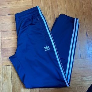 Adidas track pants.